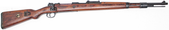An object with a strap with Springfield Armory in the background
